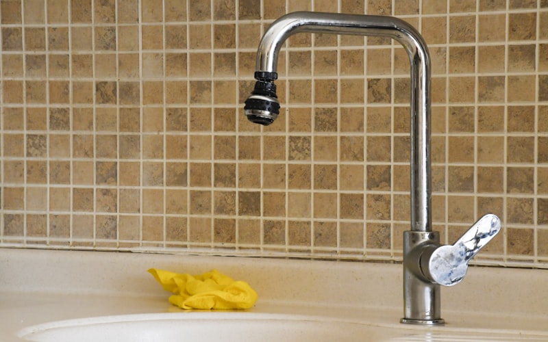 Clear glass pitcher of purified water on a countertop